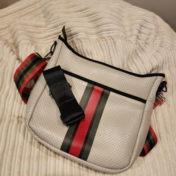 Haute Shore Neoprene cross body bag light beige with black and red accents. - Picture 3 of 3